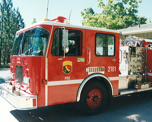 Front half of a Vintage fire engine in red color