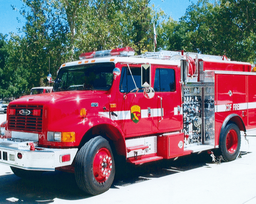 A truck shaped vintage fire engine in red