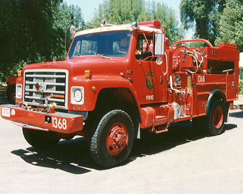 Red colored vintage fire engine parked